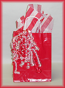 This Valentine gift bag contains lots of sweet treats – chocolate hearts, cookies, candy, nuts and so much more!